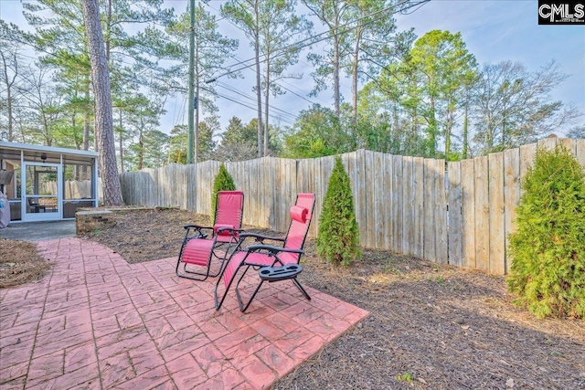 3139 Travis Ct, Columbia, SC 29204 - fenced backyard featuring a sunroom and a patio