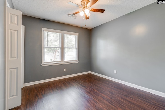 40 Stonehedge Ct, Sumter, SC 29154 - spare room featuring ceiling fan, dark wood-style flooring, and a textured ceiling