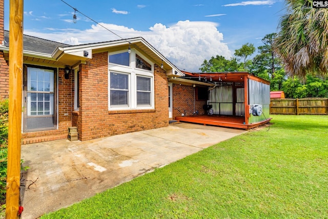 40 Stonehedge Ct, Sumter, SC 29154 - back of property featuring a deck, brick siding, and a patio area