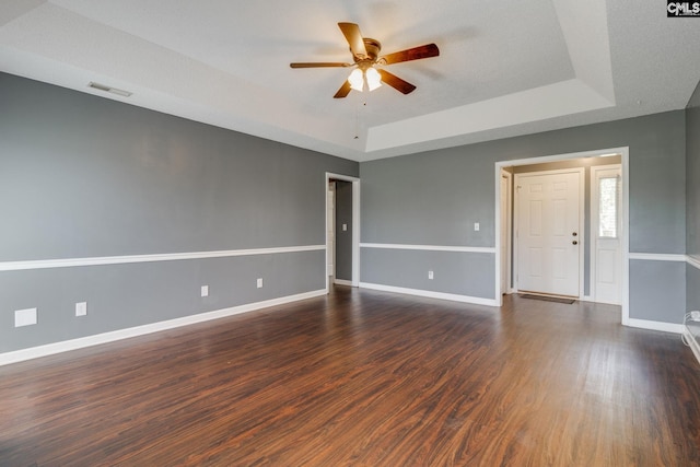 40 Stonehedge Ct, Sumter, SC 29154 - spare room with a raised ceiling, a ceiling fan, and dark wood-type flooring