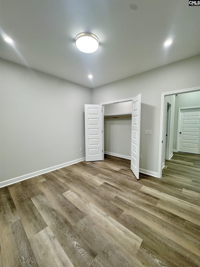 10 Lincolnshire Ct, Columbia, SC 29203 - unfurnished bedroom featuring wood finished floors, recessed lighting, and a closet