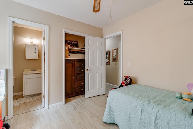 255 Sunnydale Dr, Columbia, SC 29223 - bedroom featuring light wood-style flooring, connected bathroom, and ceiling fan