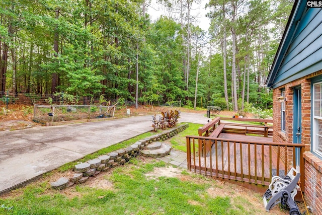 255 Sunnydale Dr, Columbia, SC 29223 - view of yard with a garden, a wooden deck, and a wooded view