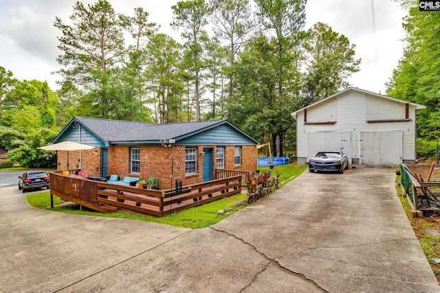 255 Sunnydale Dr, Columbia, SC 29223 - ranch-style home featuring a detached garage, brick siding, and view of wooded area