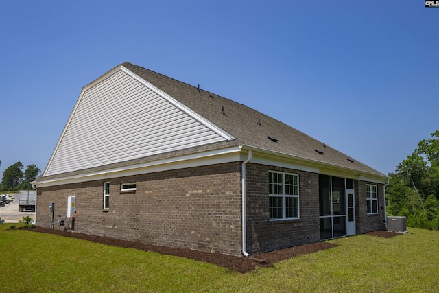 259 Backspin Dr, Elgin, SC 29045 - view of side of property with brick siding, a lawn, and a sunroom