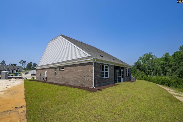 259 Backspin Dr, Elgin, SC 29045 - view of home's exterior featuring brick siding and a lawn