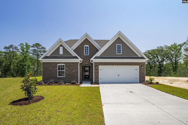 259 Backspin Dr, Elgin, SC 29045 - view of front of property with a front lawn, brick siding, concrete driveway, and a garage