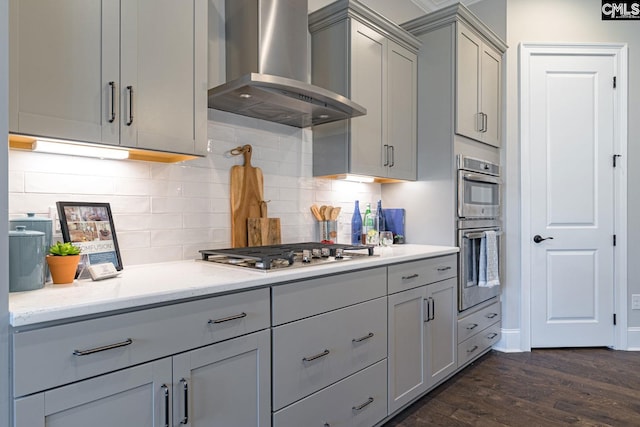 2340 Hadley Xing, Chapin, SC 29036 - kitchen featuring extractor fan, gray cabinetry, stainless steel appliances, dark wood finished floors, and decorative backsplash