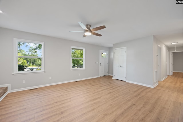 100 Coventry Ct, Lexington, SC 29072 - unfurnished living room with attic access, ceiling fan, and light wood finished floors