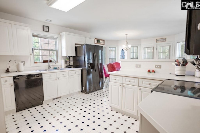 108 Warden Way, Irmo, SC 29063 - kitchen with black appliances, white cabinetry, a chandelier, light countertops, and decorative light fixtures