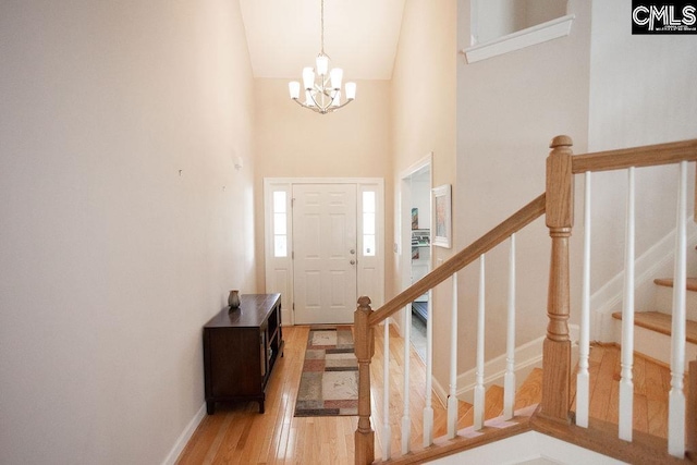 108 Warden Way, Irmo, SC 29063 - foyer entrance featuring a chandelier, light wood-style flooring, high vaulted ceiling, and stairs
