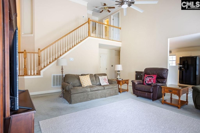 108 Warden Way, Irmo, SC 29063 - living room featuring carpet, a towering ceiling, stairs, a ceiling fan, and ornamental molding