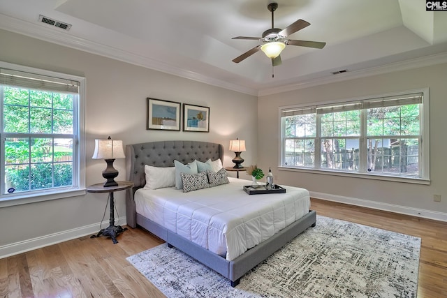 305 W Ashford Way, Irmo, SC 29063 - bedroom featuring a raised ceiling, crown molding, wood finished floors, and a ceiling fan