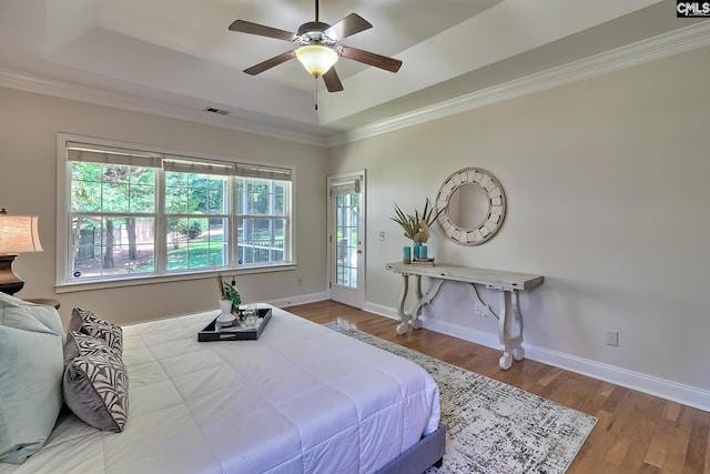 305 W Ashford Way, Irmo, SC 29063 - bedroom featuring a raised ceiling, access to exterior, wood finished floors, ornamental molding, and a ceiling fan
