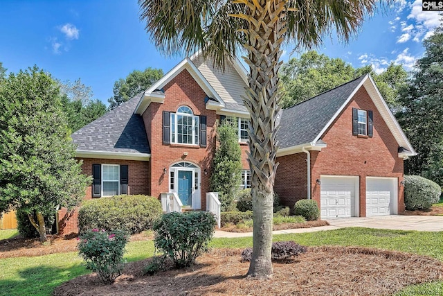 305 W Ashford Way, Irmo, SC 29063 - view of front of home featuring brick siding, driveway, roof with shingles, an attached garage, and a front lawn