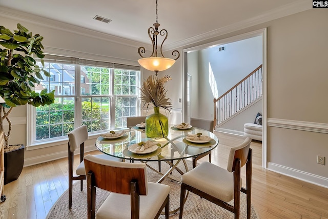 305 W Ashford Way, Irmo, SC 29063 - dining room with plenty of natural light, light wood finished floors, crown molding, and stairway