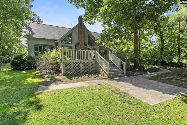 242 Arrow Shores Rd, Chapin, SC 29036 - rear view of house with a yard, a chimney, a deck, and roof with shingles