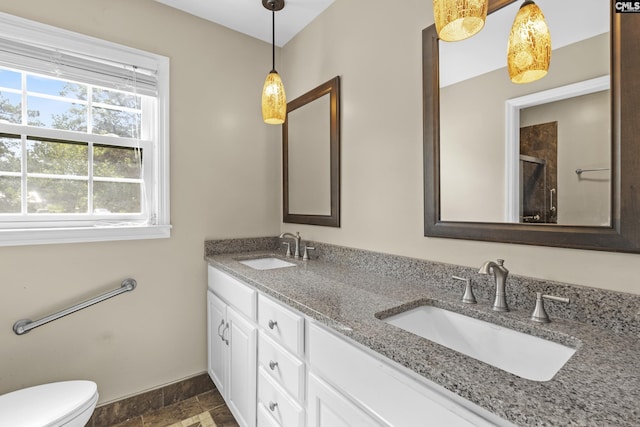 242 Arrow Shores Rd, Chapin, SC 29036 - full bathroom with double vanity, stone finish flooring, and an enclosed shower