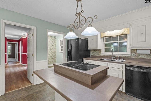 242 Arrow Shores Rd, Chapin, SC 29036 - kitchen featuring black appliances, white cabinetry, a center island, pendant lighting, and crown molding