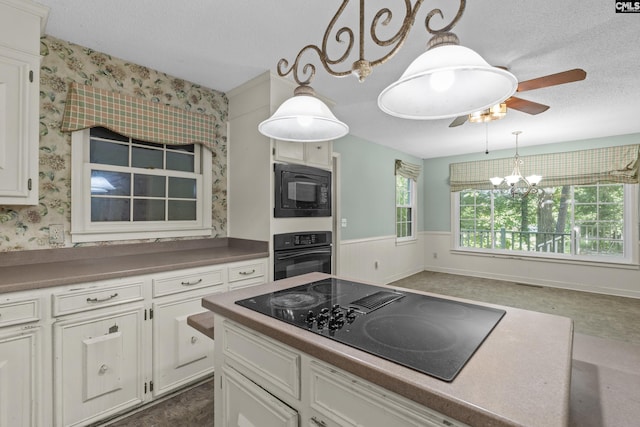 242 Arrow Shores Rd, Chapin, SC 29036 - kitchen featuring black appliances, wallpapered walls, ceiling fan, a textured ceiling, and white cabinetry