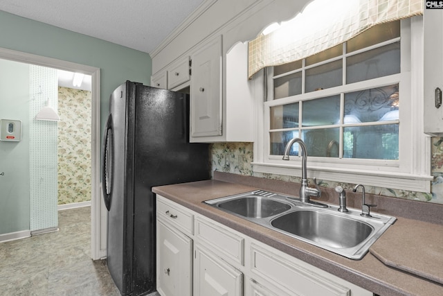 242 Arrow Shores Rd, Chapin, SC 29036 - kitchen with white cabinetry, freestanding refrigerator, and a textured ceiling