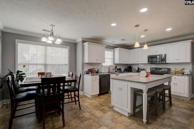 7 Chickasaw Cir, Columbia, SC 29229 - kitchen featuring black appliances, white cabinets, tasteful backsplash, ornamental molding, and a center island