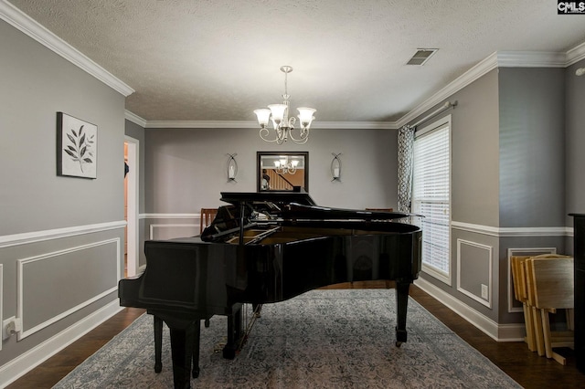 7 Chickasaw Cir, Columbia, SC 29229 - living area featuring dark wood-style flooring, a chandelier, a textured ceiling, and ornamental molding