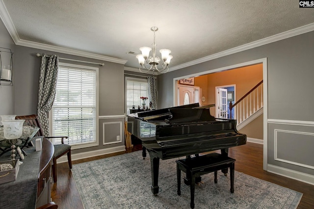 7 Chickasaw Cir, Columbia, SC 29229 - living area featuring a chandelier, a textured ceiling, crown molding, dark wood-type flooring, and wainscoting