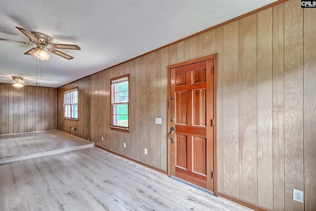 1700 Cermack St, Columbia, SC 29223 - foyer with a ceiling fan, wood finished floors, wooden walls, a textured ceiling, and ornamental molding