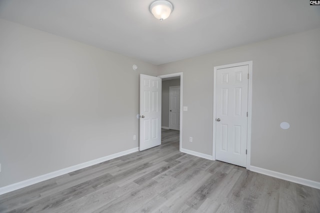 233 Eagle Pointe Dr, Chapin, SC 29036 - unfurnished bedroom with wood finished floors and baseboards