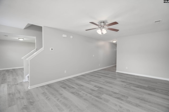 233 Eagle Pointe Dr, Chapin, SC 29036 - unfurnished room featuring a ceiling fan, wood finished floors, and stairs