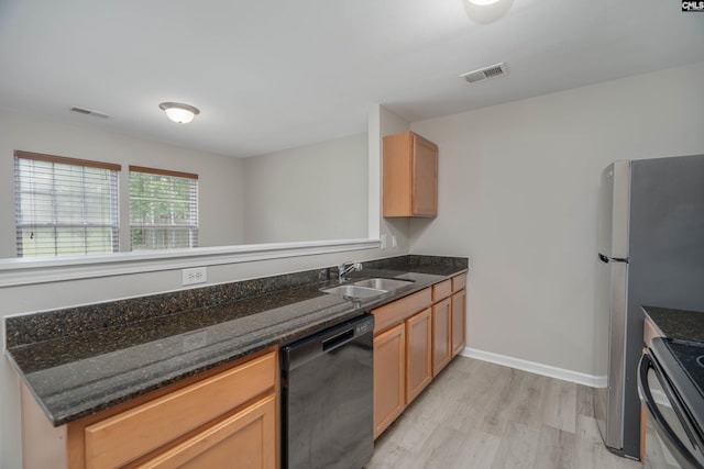 233 Eagle Pointe Dr, Chapin, SC 29036 - kitchen with black appliances, light wood-style flooring, and dark stone counters