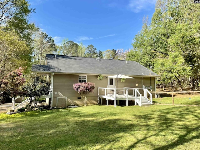 3909 E Peach Rd, Ridgeway, SC 29130 - rear view of house with a lawn and a wooden deck