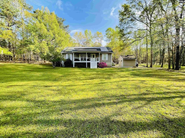 3909 E Peach Rd, Ridgeway, SC 29130 - rear view of house with solar panels and a lawn
