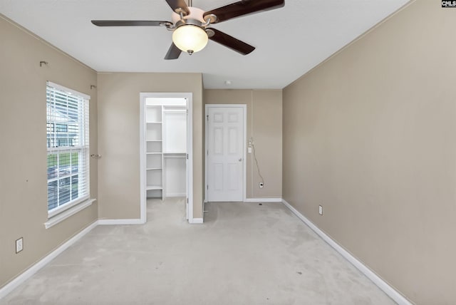 339 Bracken Dr, Lexington, SC 29072 - unfurnished bedroom with light carpet, a walk in closet, ceiling fan, and a closet