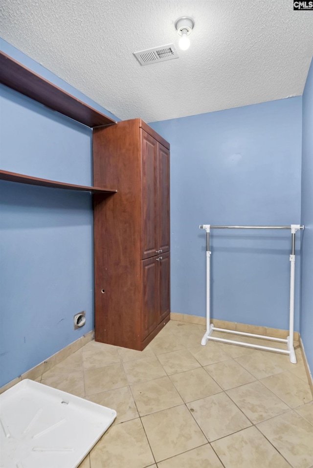 339 Bracken Dr, Lexington, SC 29072 - laundry room featuring a textured ceiling and light tile patterned floors