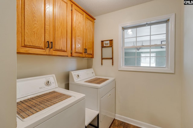 1162 Whippoorwill Rd, Camden, SC 29020 - laundry area with separate washer and dryer, cabinet space, dark wood-type flooring, and a textured ceiling