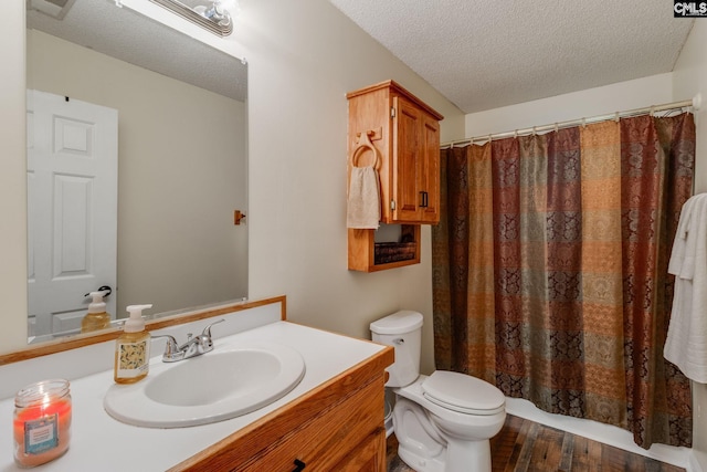 1162 Whippoorwill Rd, Camden, SC 29020 - bathroom featuring vanity, a textured ceiling, wood finished floors, and a shower with curtain