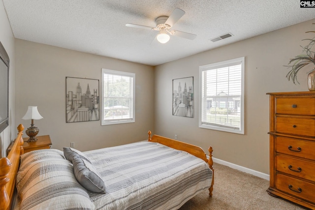 1162 Whippoorwill Rd, Camden, SC 29020 - bedroom with light colored carpet, a textured ceiling, and ceiling fan