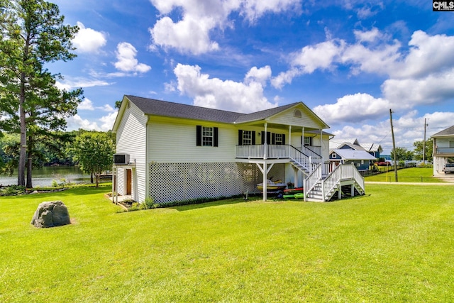 1162 Whippoorwill Rd, Camden, SC 29020 - rear view of house featuring stairway, a yard, and a water view