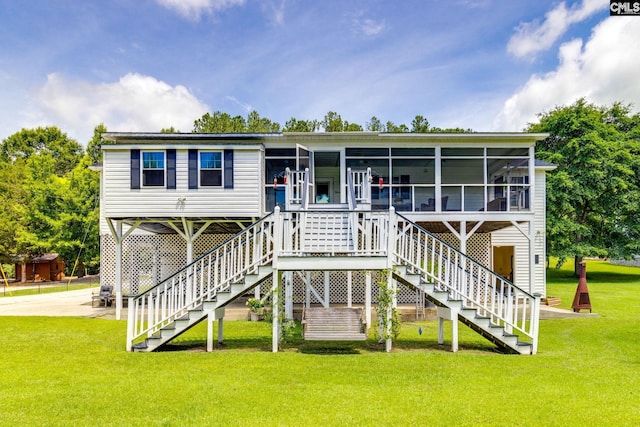 1162 Whippoorwill Rd, Camden, SC 29020 - rear view of property with a yard, stairs, and a sunroom