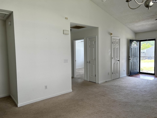 206 Windsor Village Dr, Columbia, SC 29223 - foyer entrance with carpet flooring, a textured ceiling, and lofted ceiling