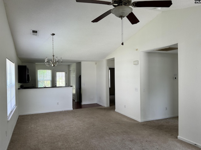 206 Windsor Village Dr, Columbia, SC 29223 - empty room featuring carpet flooring, a chandelier, ceiling fan, and high vaulted ceiling