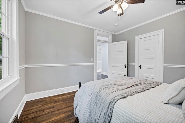 2625 Harrison Rd, Columbia, SC 29204 - bedroom with dark wood finished floors, ornamental molding, and ceiling fan