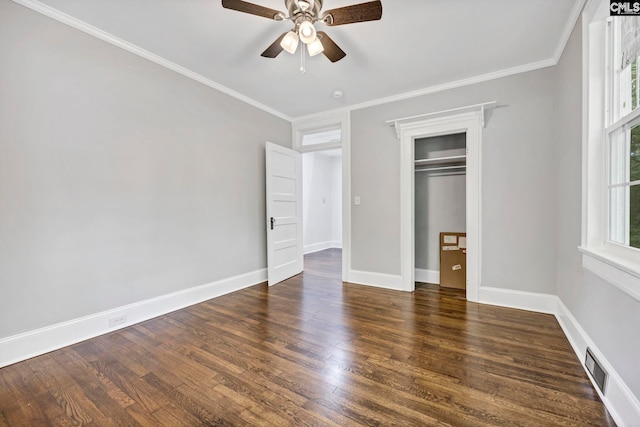 2625 Harrison Rd, Columbia, SC 29204 - unfurnished bedroom with wood finished floors, crown molding, a ceiling fan, and a closet