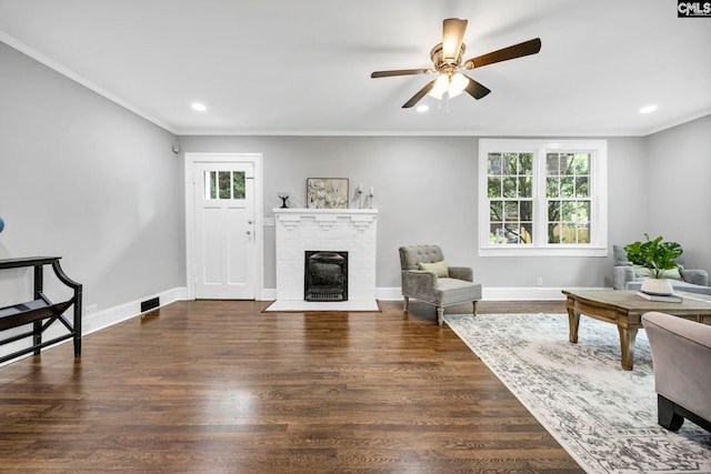 2625 Harrison Rd, Columbia, SC 29204 - living area featuring a ceiling fan, crown molding, recessed lighting, a brick fireplace, and wood finished floors