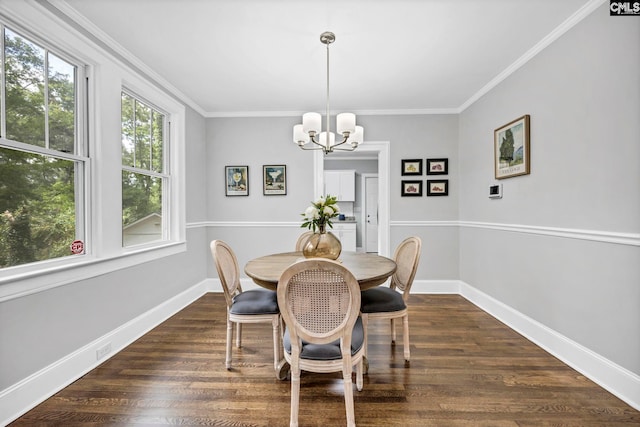 2625 Harrison Rd, Columbia, SC 29204 - dining area featuring a chandelier, dark wood-style flooring, and crown molding