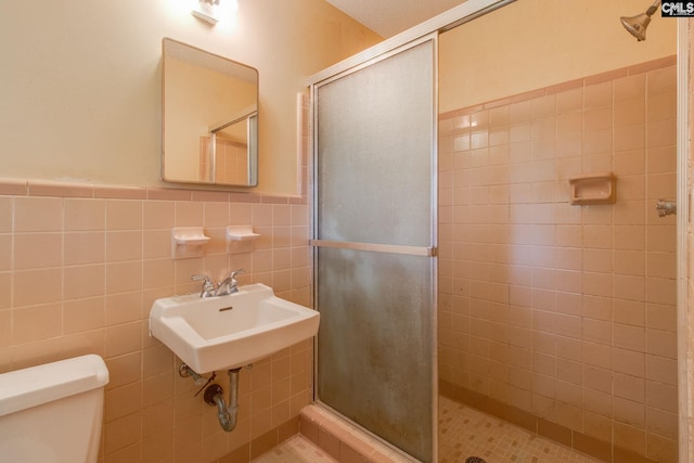109 Garden Springs Rd, Columbia, SC 29209 - bathroom with a stall shower, tile walls, and wainscoting