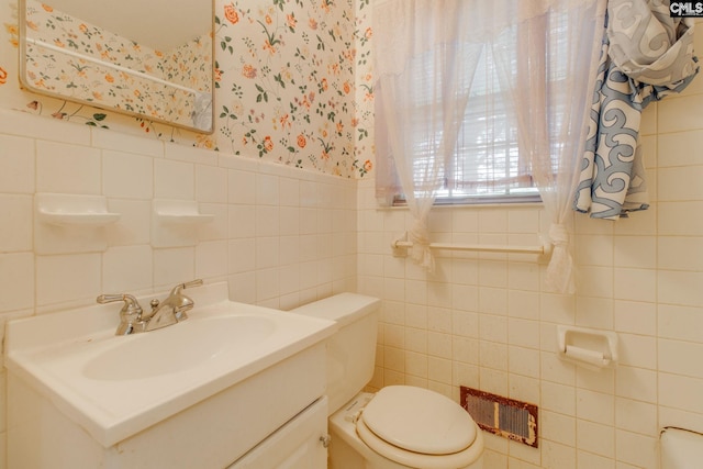 109 Garden Springs Rd, Columbia, SC 29209 - bathroom featuring wallpapered walls, vanity, tile walls, and a wainscoted wall