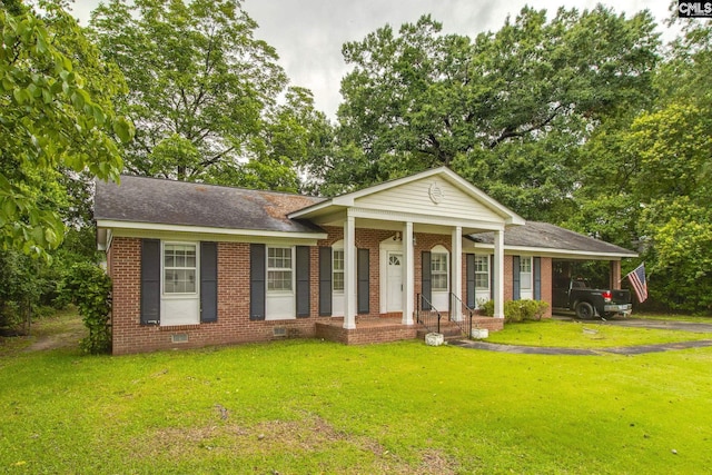 109 Garden Springs Rd, Columbia, SC 29209 - view of front of home featuring brick siding, a front yard, a carport, driveway, and roof with shingles